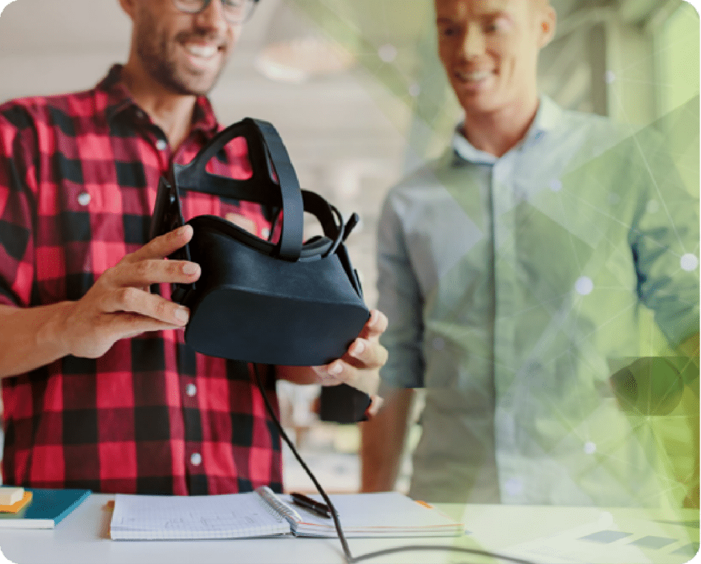 Two guys examining VR headset